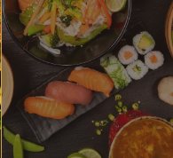 A selection of sushi rolls and salmon nigiri
